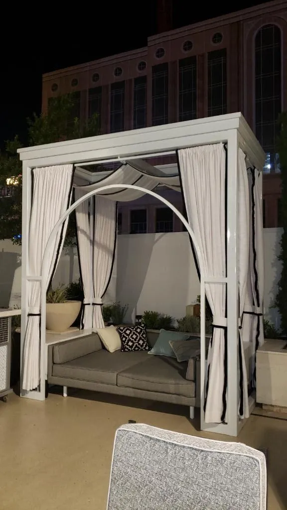 Outdoor pool cabana with custom drapery